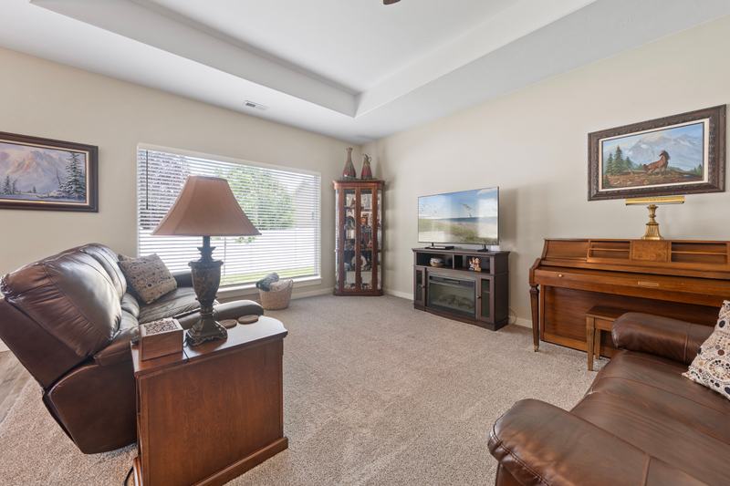 Extra-high ceilings and a granite island give the main living space real presence