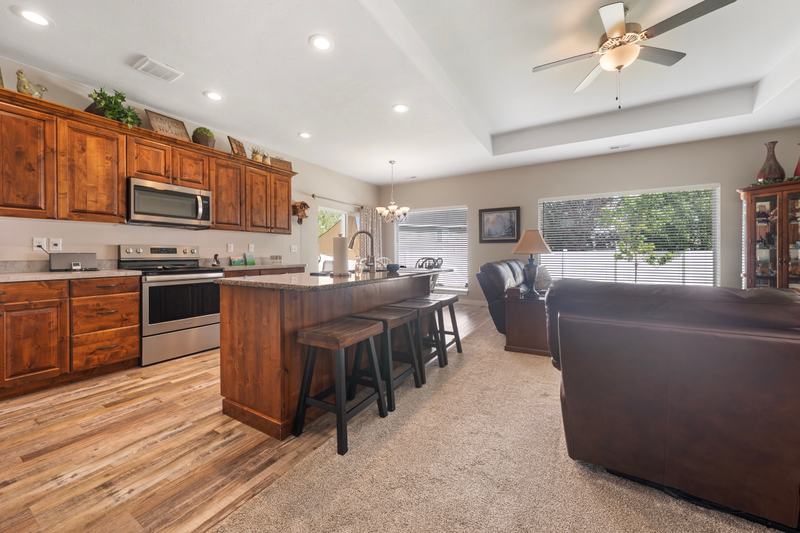 Extra-high ceilings and a granite island give the main living space real presence