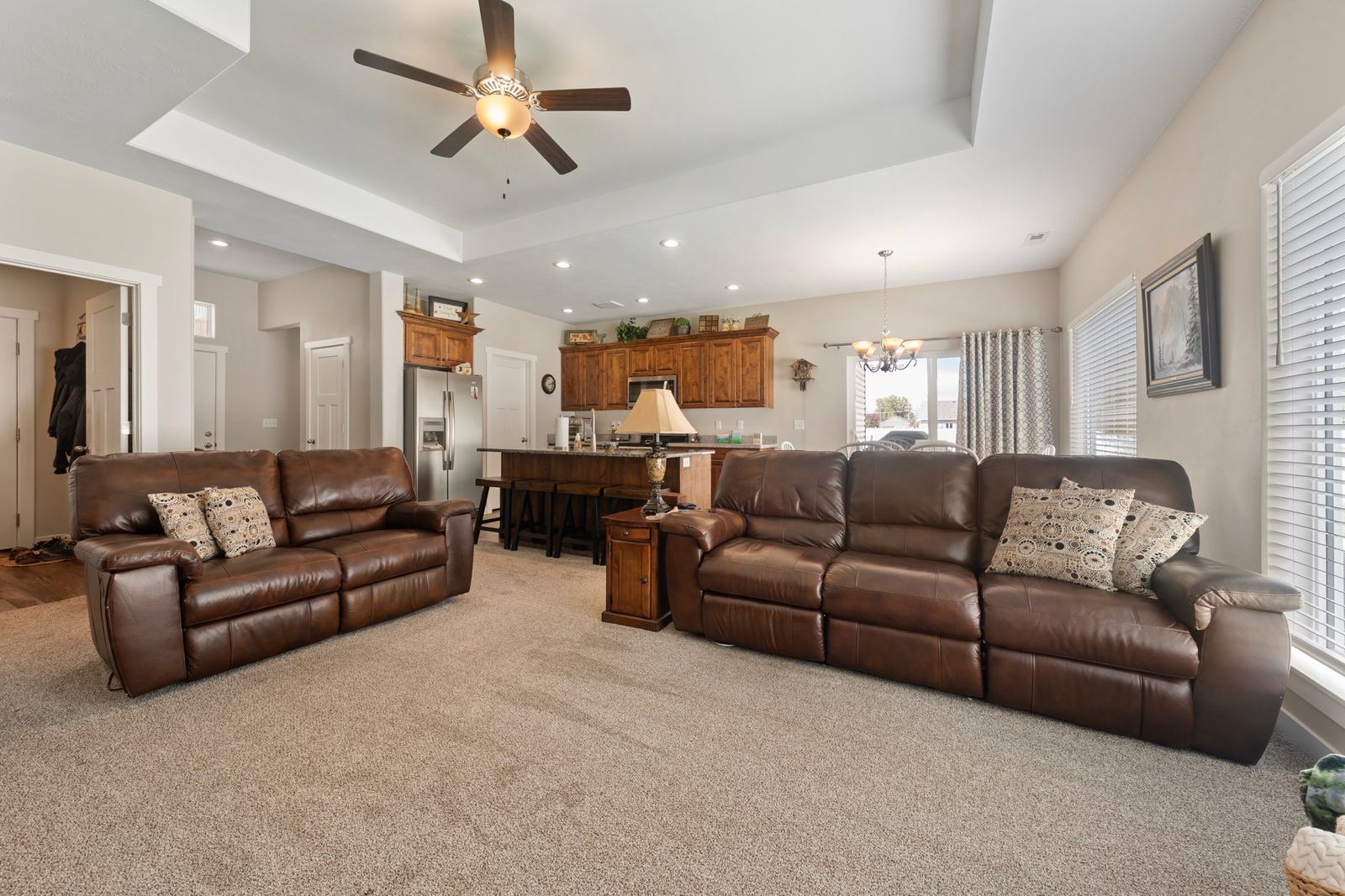 Extra-high ceilings and a granite island give the main living space real presence