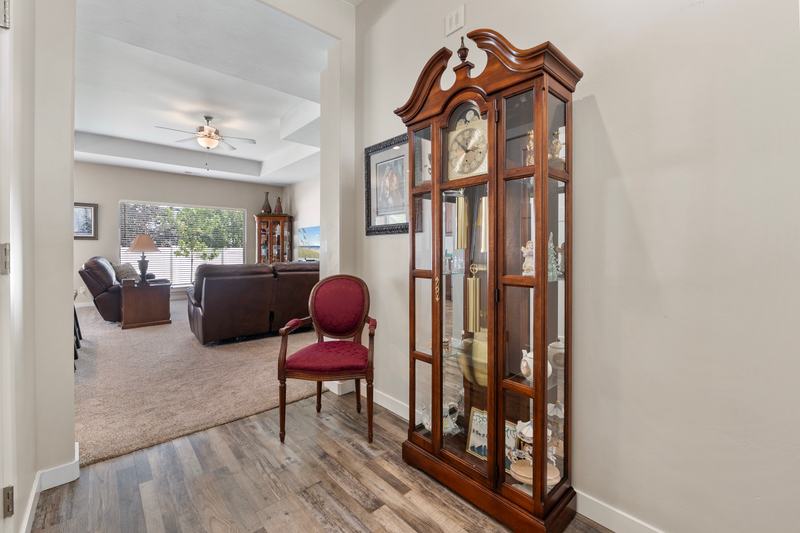 Extra-high ceilings and a granite island give the main living space real presence